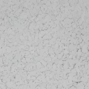 Textured white surface with speckles