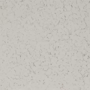Textured light gray surface with speckles