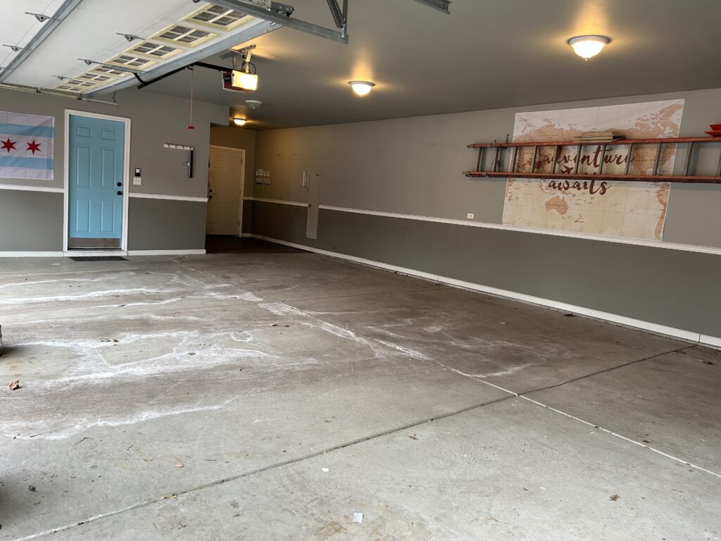 Empty garage with blue door